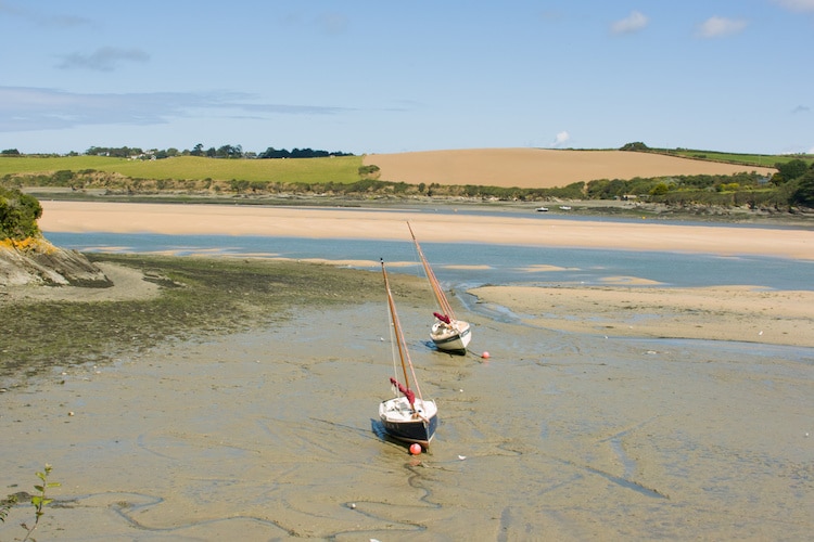 Boats on a creek in the Camel Estuary near St issey in Cornwall