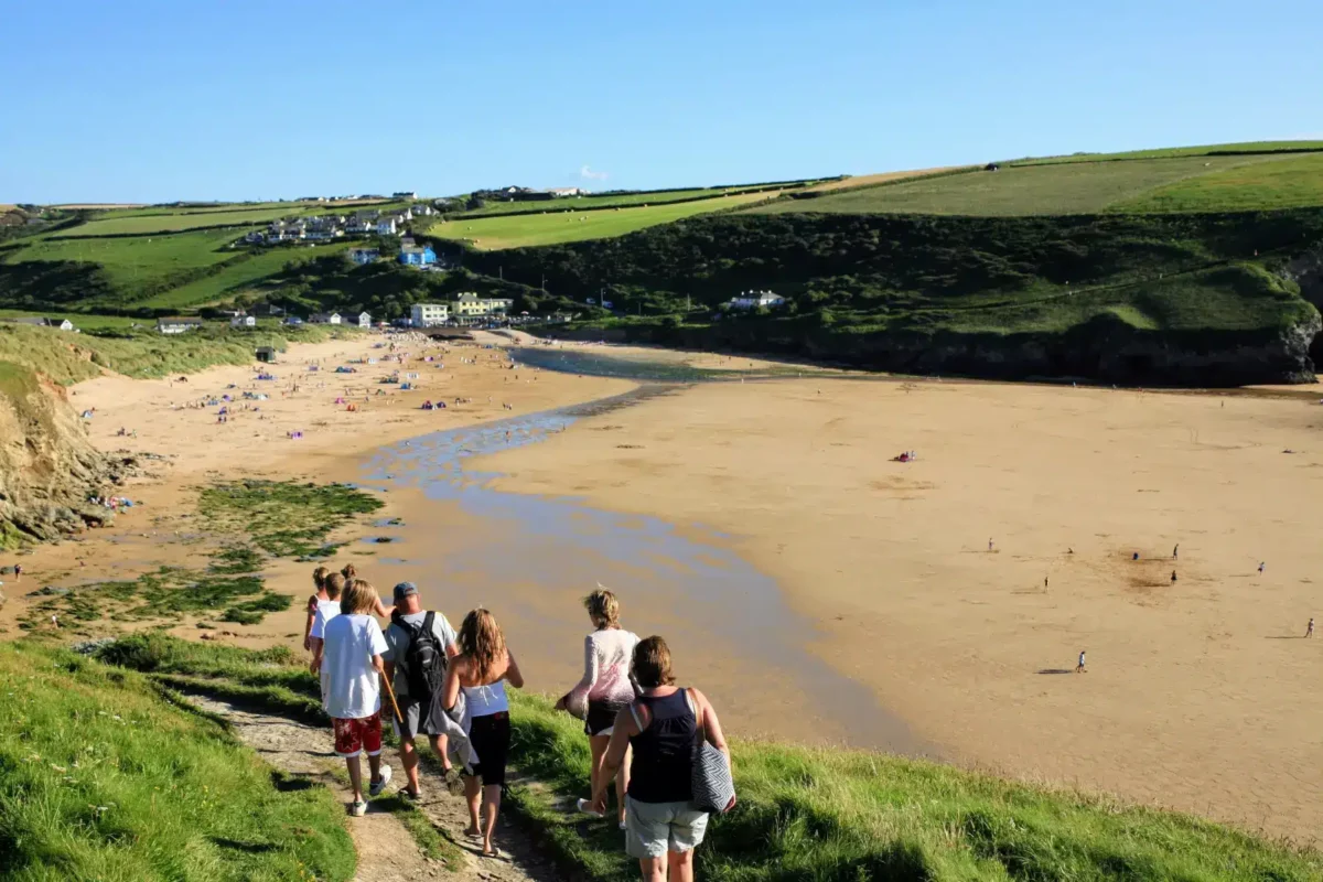 Walkers above Mawgan Porth Beach